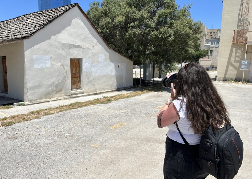 Photographer Kat Swansey lines up a shot in downtown San Antonio.