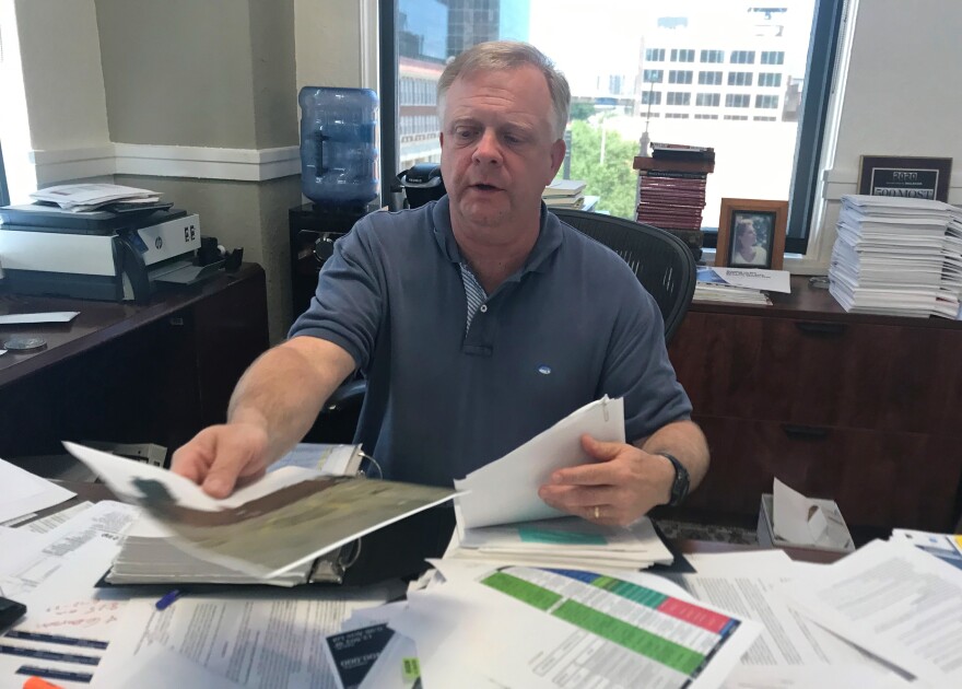Deep Ellum property owner Scott Rohrman going through photos and documents he may donate to the Deep Ellum Archive