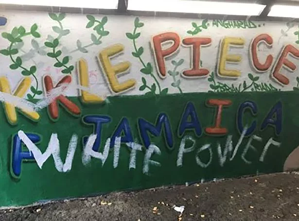 The racist graffiti daubed on a Windrush mural in Port Talbot by Haynes