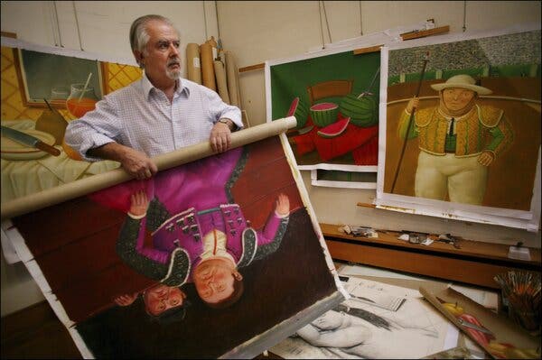 Mr. Botero, in shirt sleeves, rolling up one of his canvases, depicting a bullfighter. Other paintings of his are on a wall to his left.