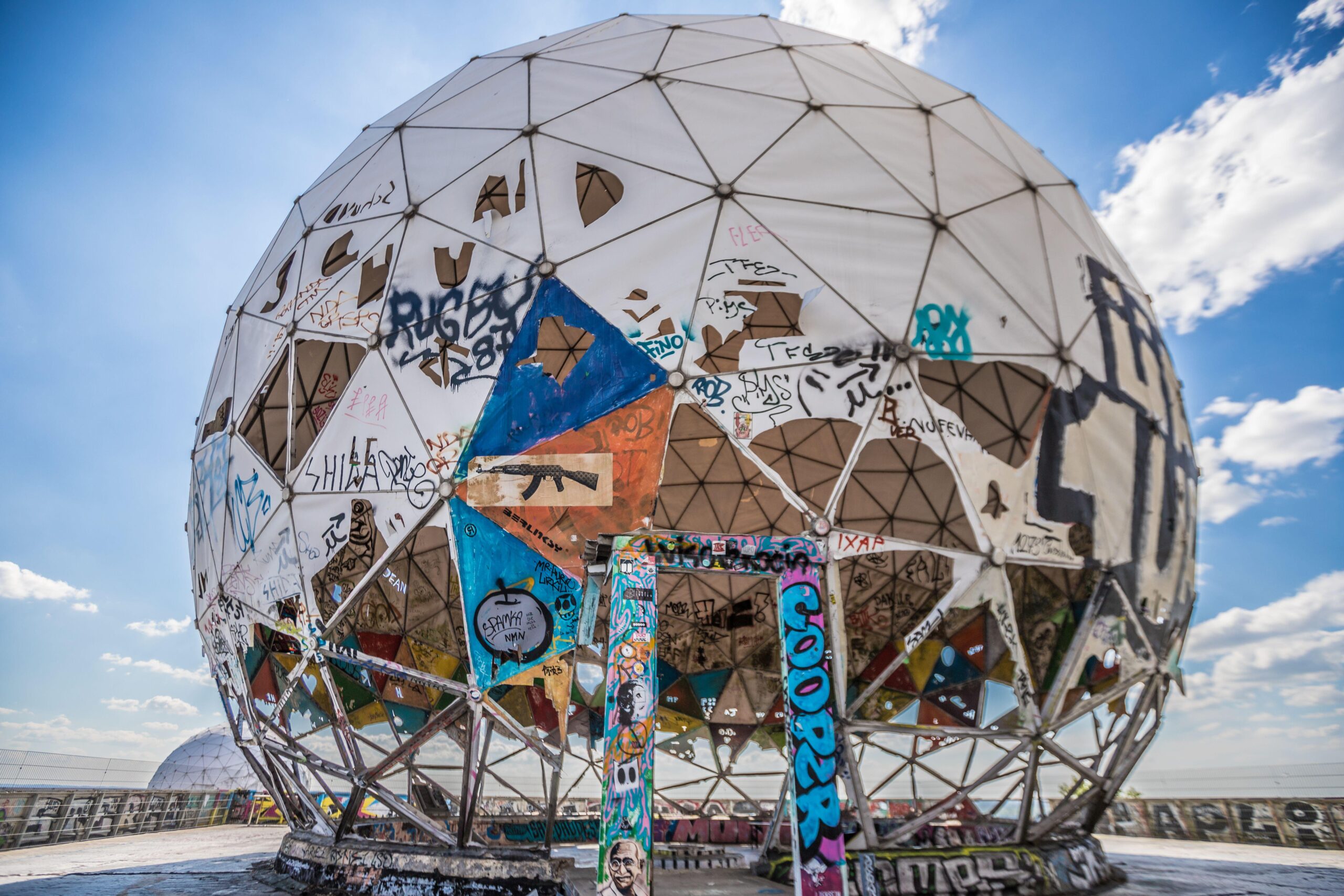 The iconic 'Berlin balls' were left to rot but have been given a splash of colour by street artists