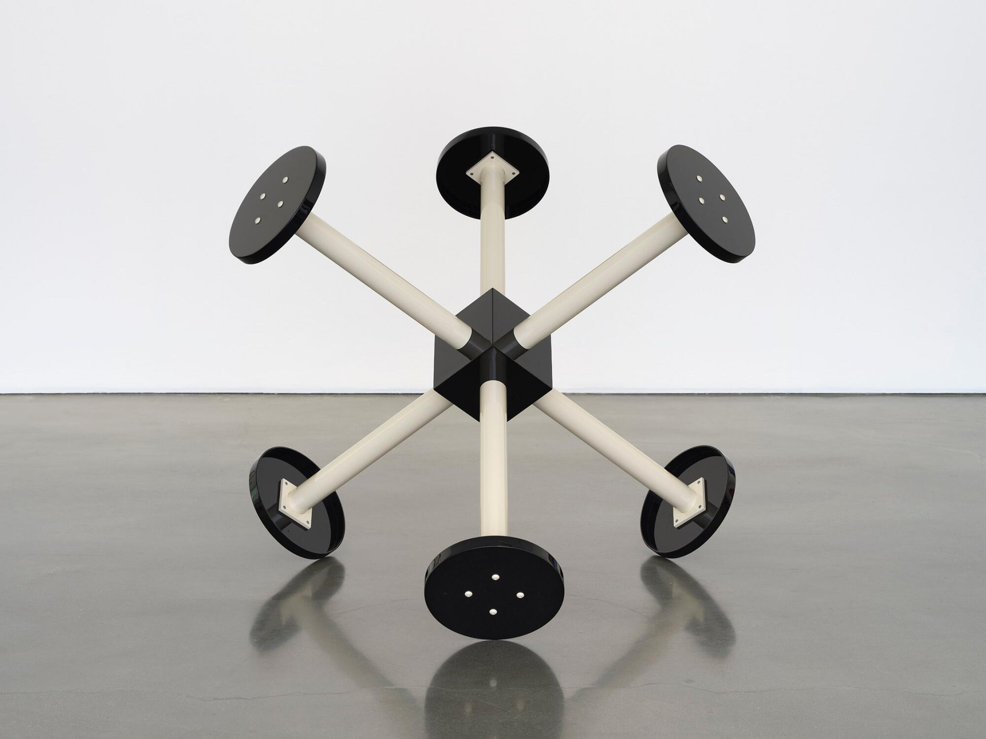 An artwork that looks like a black and white Tinkertoy construction