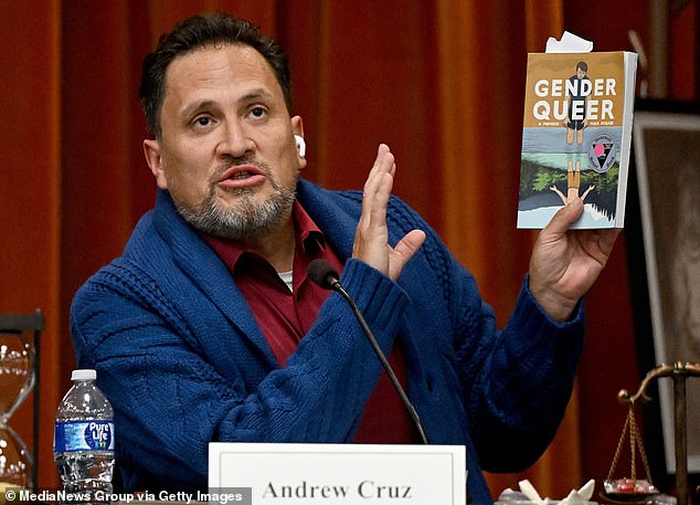 It is a book that has caused contention across the county. Chino Valley Unified School District clerk Andrew Cruz is seen reading from Gender Queer during a heated public board meeting at Don Lugo High School in Chino on July 20, 2023