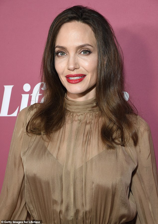 Angelina (seen in 2021) admitted that she has felt 'a bit down these days,' adding, 'I don’t feel like I’ve been myself for a decade.' She also said she's in the midst of 'transitioning as a person'