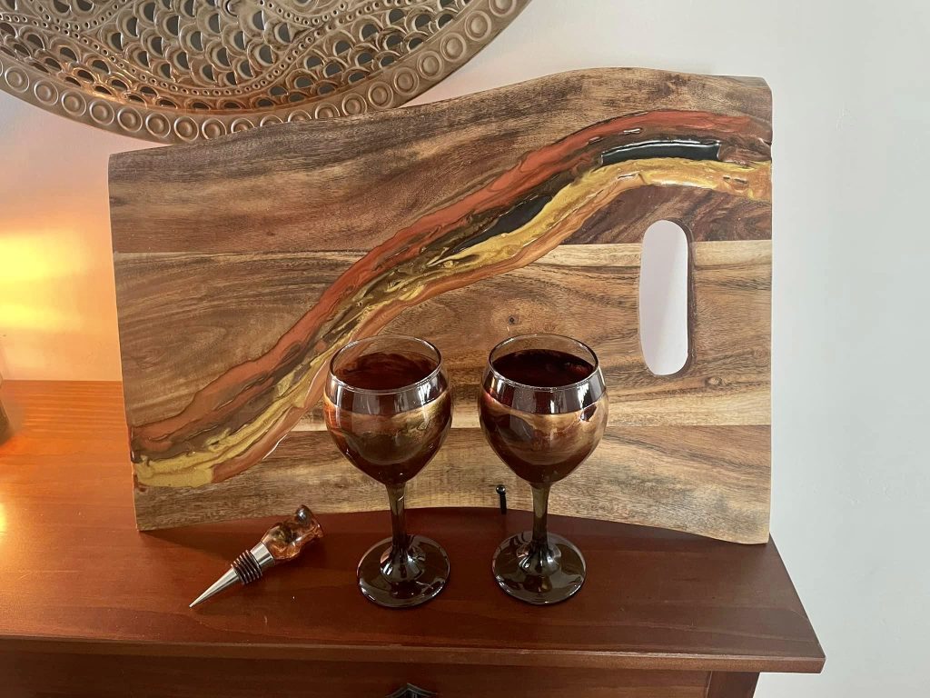 A matching cutting board, glasses and wine stopper by KC's Creations are pictured, location and date unspecified | Photo courtesy of Kent Schlientz, St. George News