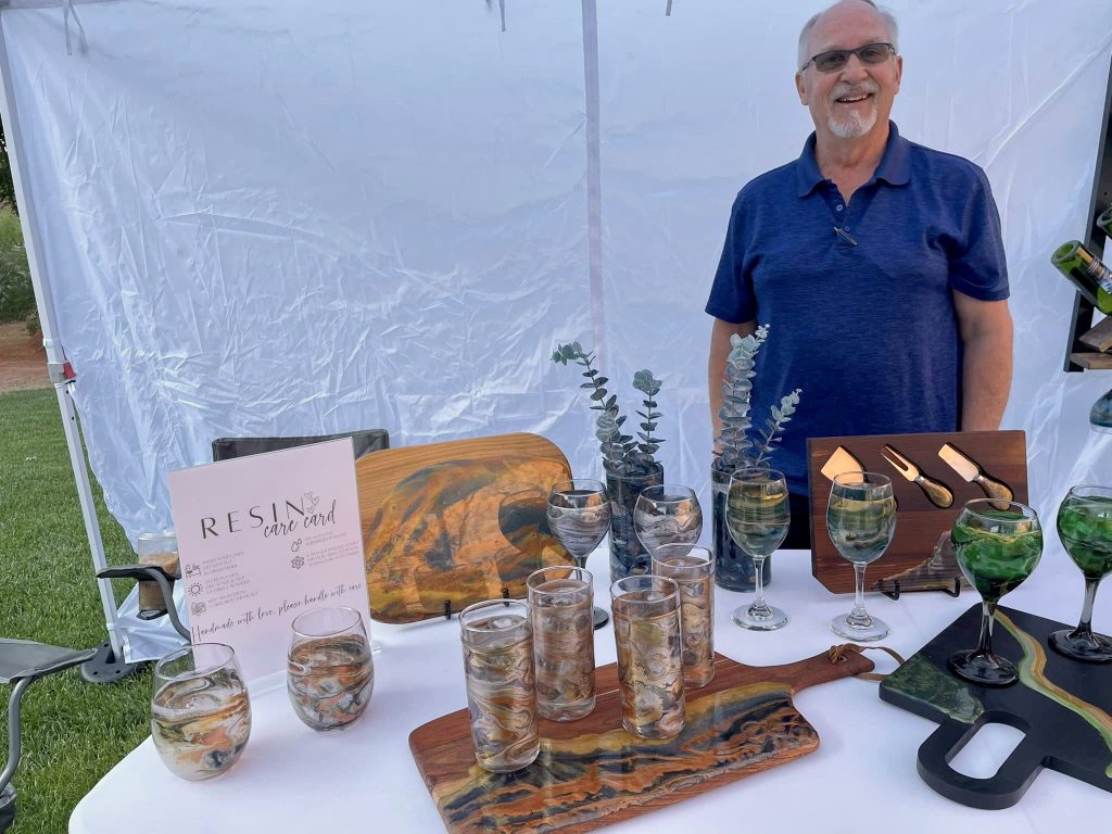 Kent Schlientz stands inside the KC's Creations booth at a local market, location and date unspecified | Photo courtesy of Kent Schlientz, St. George News
