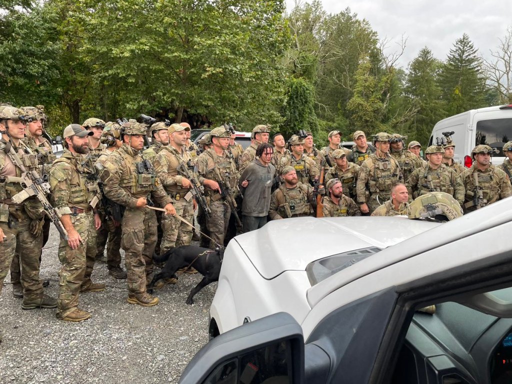 SWAT officers posed with Cavalcante after they captured him following a massive 14-day manhunt in Pennsylvania