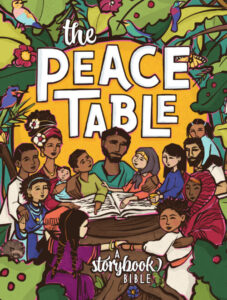 Image of The Peace Table cover, which features Jesus surrounded by children and adults, looking at a book. The background is made up of leaves, flowers and birds.