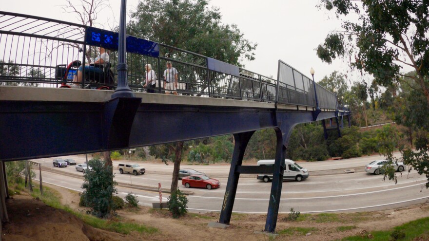 A cyclist rides over the Vermont Street Bridge in University Heights. September 15, 2023.