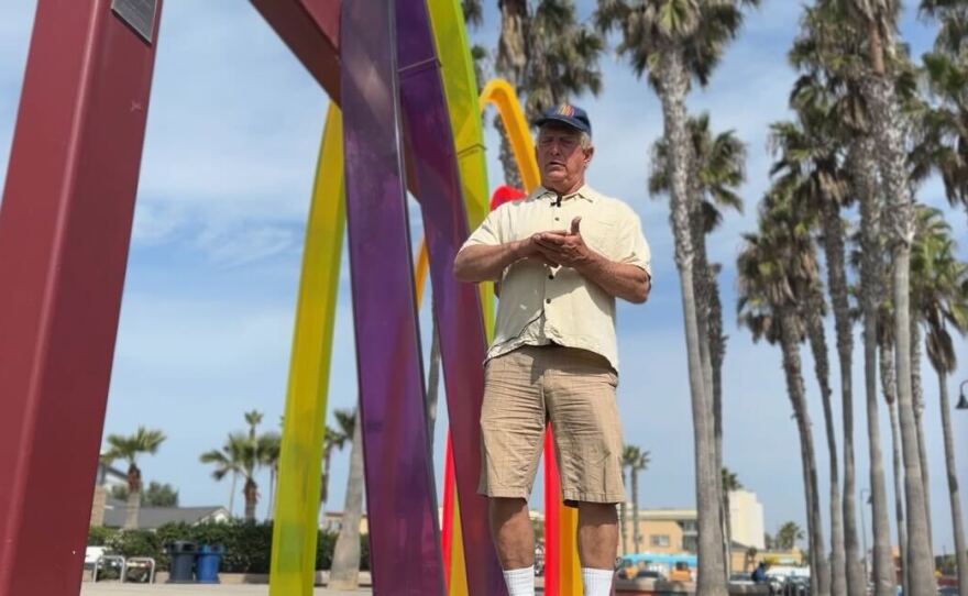 Sculptor Malcolm Jones stands in front of Surfhenge, his iconic public art installation in Imperial Beach in this undated photo.