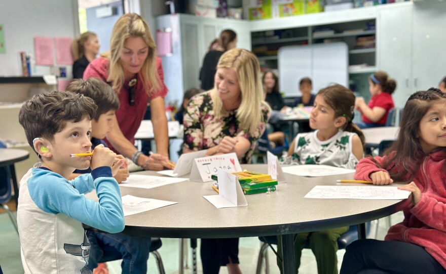Heather Gaunt (standing) works with an ASL interpreter to teach visual arts to students who are deaf and hard of hearing at Lafayette Elementary, San Diego, Calif., October 30, 2023