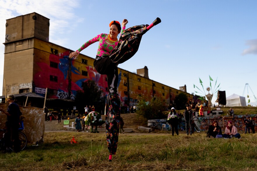 Margaret “Mega Legs” Wilson, 42, of Carondelet, dances on Sunday, Oct. 8, 2023, during the Artica Urban Art Festival along the Mississippi Riverfront in downtown St. Louis.