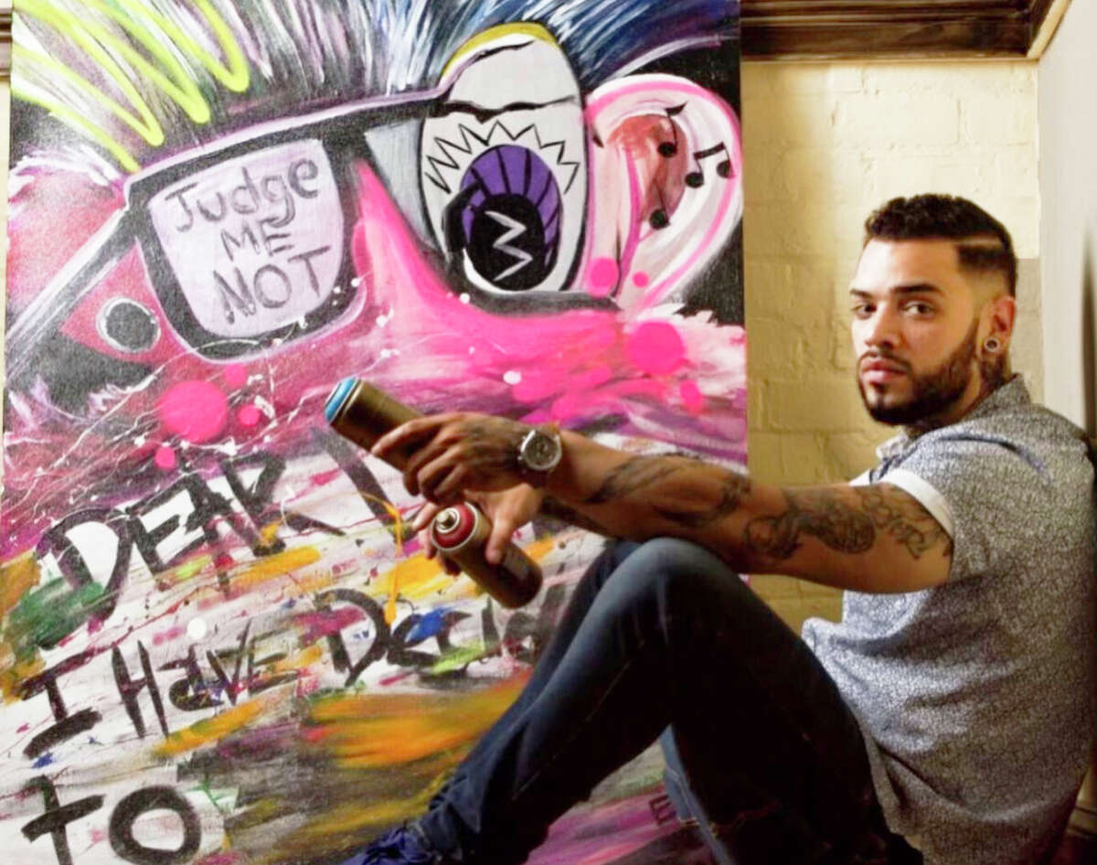 Meriden artist, hairstylist and hip-hop musician Eddie Rivera recently completed a portion of a giant, floral-themed mural in the back alleyway of 418-20 Main St. in Middletown. He's also done murals around the state.