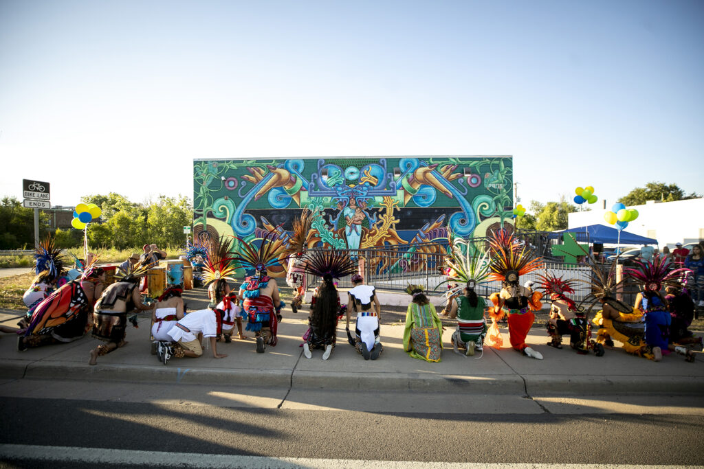Dancers with Groupo Tlaloc bless a mural by David Ocelotl Garcia on the side of Mana Supply Co.'s Sun Valley storefront. July 28, 2023.