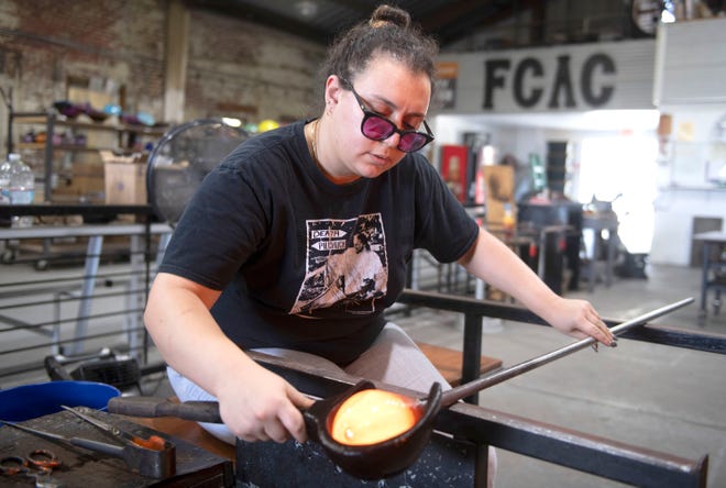 Jessica Khalil finishes one of her final glass pumpkins at the First City Art Center on Tuesday, Oct. 3, 2023. First City will hold its 17th annual Glass & Ceramic Pumpkin Patch this weekend, beginning with a preview on Friday, Oct. 6.