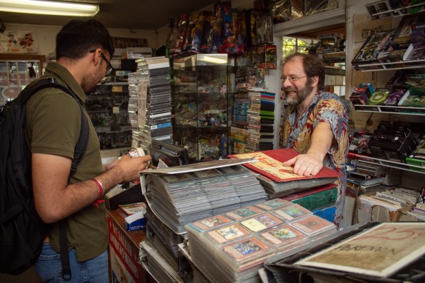 Bizarro World owner Dan Urazandi sells a John Hammond Funko Pop! toy from Jurassic Park Tuesday, Oct. 3 at 223 E St. in Davis. Urazandi said the diversity of things he offers makes his store unique to Davis. (Gerardo Zavala/Daily Democrat)