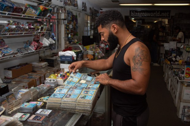 Davis resident Paul Contini, 29, looks for Pokemon cards Tuesday, Oct. 3 in Davis. Contini has been coming to Bizarro World since he was a kid and has recently gotten back into collecting cards as a way to bond with his 12-year-old nephew. (Gerardo Zavala/Daily Democrat)