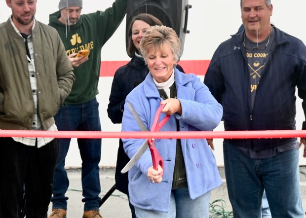 Boyertown Mayor Lori Carnes cuts the ribbon for the new...