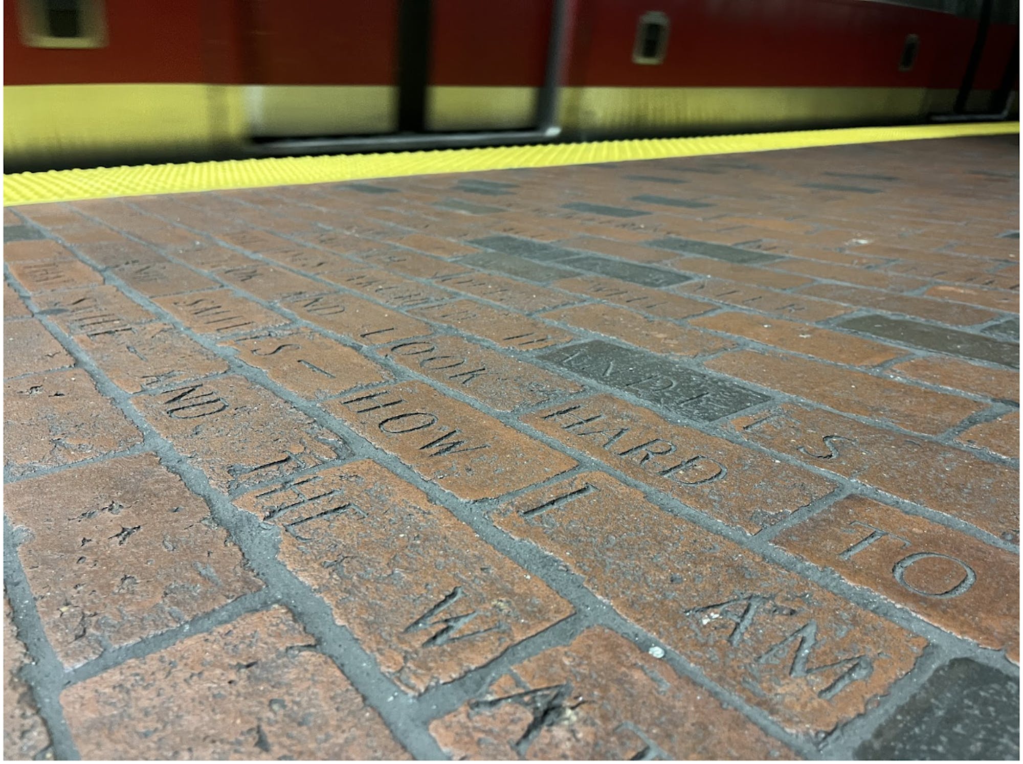 A poem engraved into the platform floor at the Davis Square station.