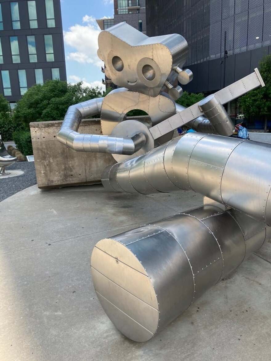'Waiting on a Train' is part of a trio of robot sculptures located in Deep Ellum.