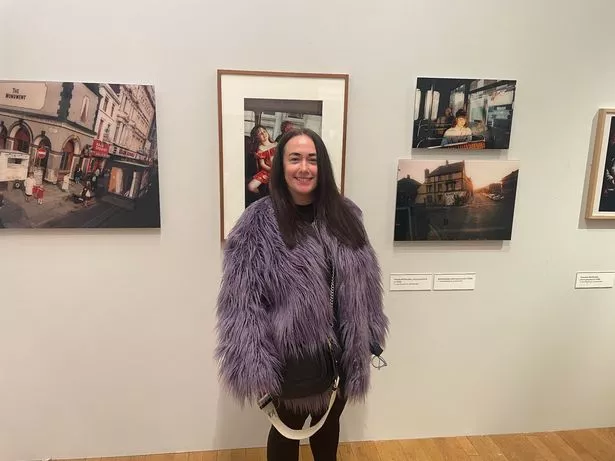 Kerry McCulloch, from New Brighton, at the Photie Man exhibition in Liverpool's Walker Art Gallery. Tom Wood photographed her as a teenager in the early 90s
