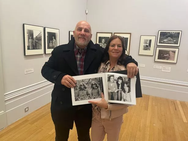Siblings John Paul Hughes and Collette Hughes at the Photie Man exhibition in Liverpool's Walker Art Gallery with a Tom Wood photograph of their family
