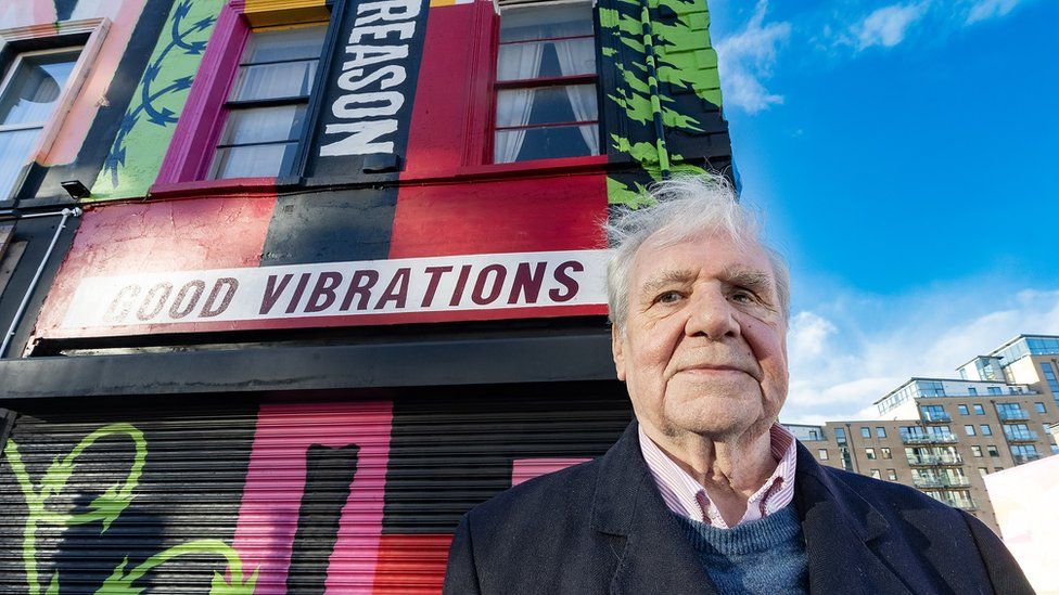 Terri Holey at belfast mural in his honour
