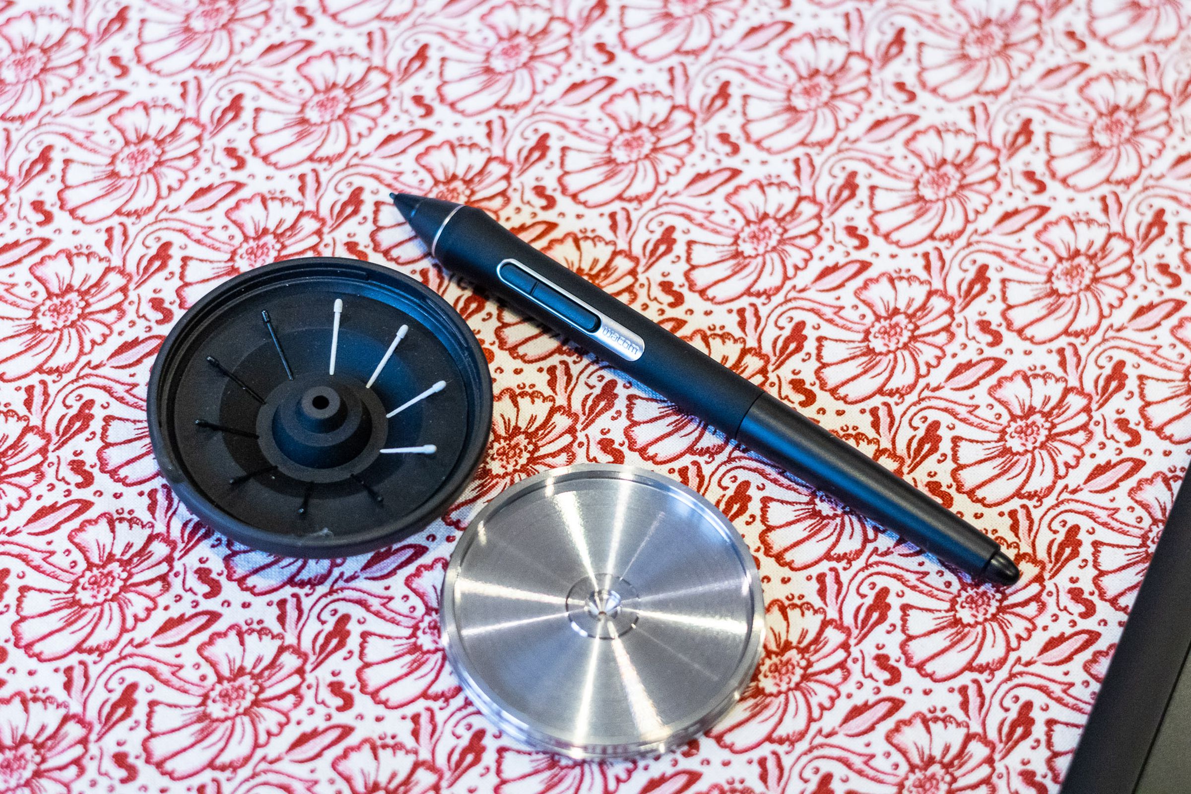 The Wacom Intuos Pro stylus and stylus holder.