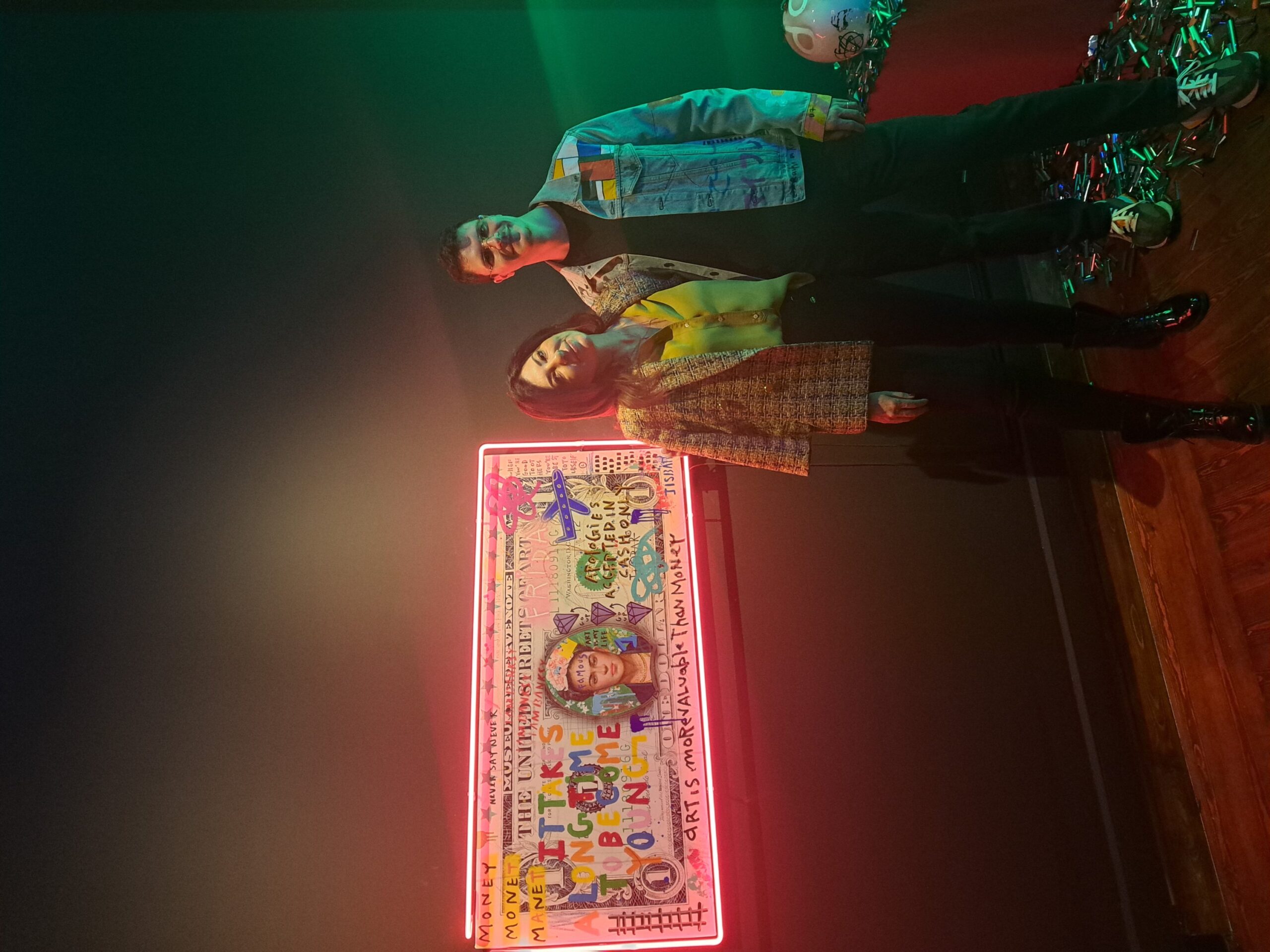 Jisbar (R) and Idil Demirel pose during the opening of