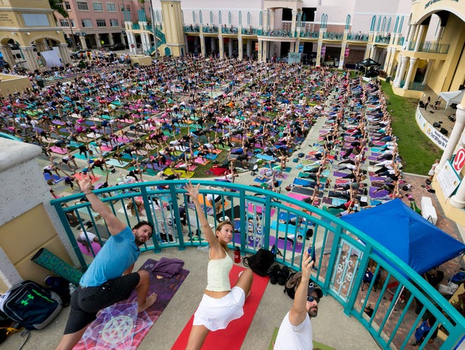 Over 1,000 people participate during the free Something BIG YOGA New Year's day community yoga gathering in the Mizner Park Amphitheater.