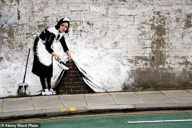 Banksy's Sweep It Under the Carpet mural, which appeared in 2006 in Chalk Farm, London