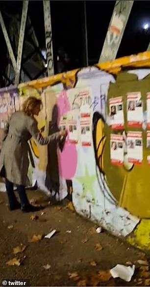 Last night, Laurini was filmed tearing down the posters by Jewish journalist Ami Kaufman