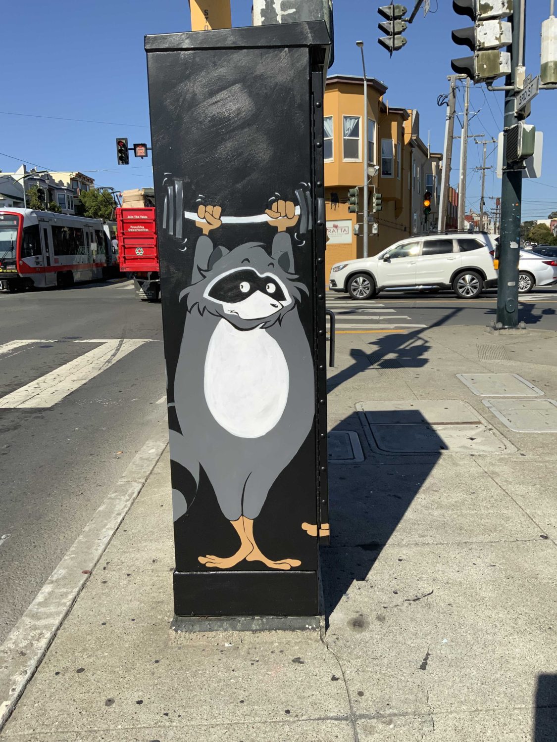 A-raccoon-lifting-weights-Bayview-Hunters-Point-art-by-Nancy-Cato, Nancy Cato helps us see ourselves through art, Culture Currents Featured Local News & Views News & Views A-raccoon-lifting-weights-Bayview-Hunters-Point-art-by-Nancy-Cato, Nancy Cato helps us see ourselves through art, Culture Currents Featured Local News & Views News & Views