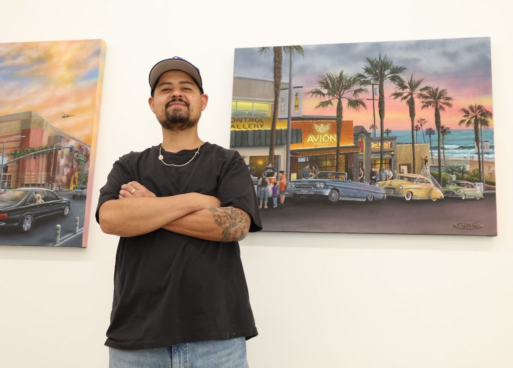 Gustavo Zermeño Jr. in front of his work at the opening of the group show 