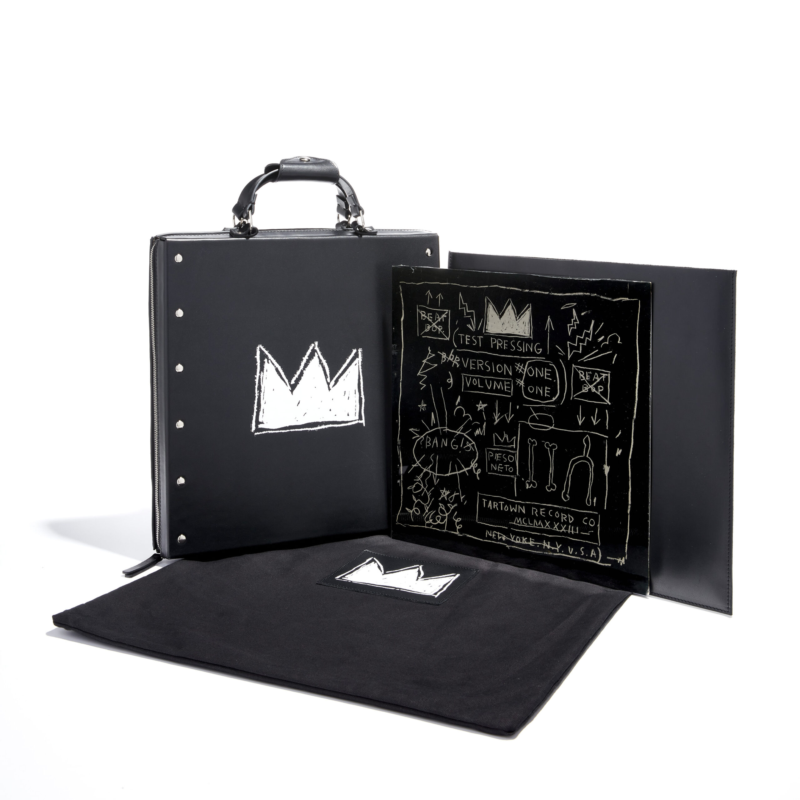 Black leather case opened to show record in black and white designed sleeve
