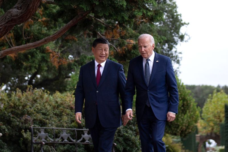 U.S. President Joe Biden (R) and Chinese President Xi Jinping walk together after a meeting during the Asia-Pacific Economic Cooperation leaders' week in Woodside, California.