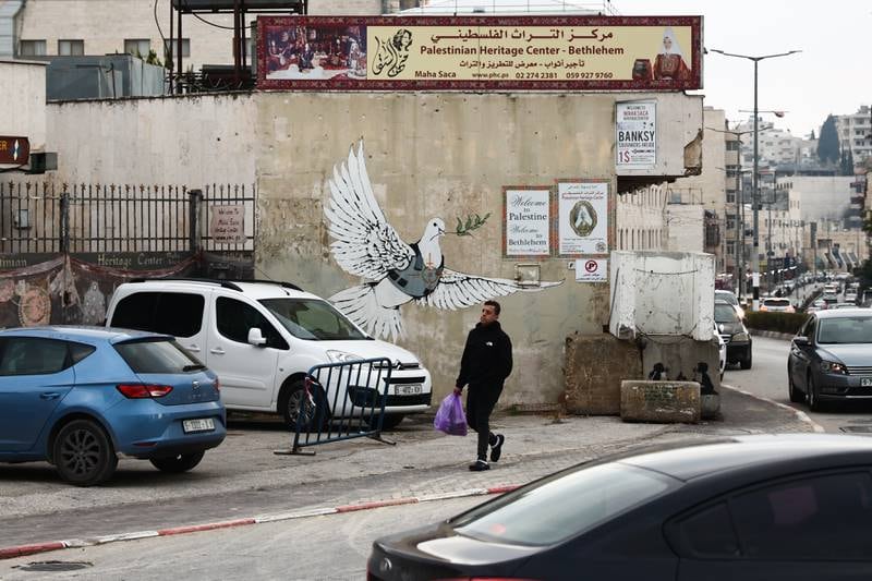 Banksy's dove mural is seen in Bethlehem, Palestinian in December 2020. Getty Images