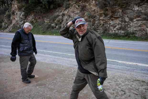Luis Peña, 69, and his brother Arnold, 64, search for...