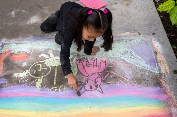 Celine Rodriguez, 7, as she participates in the Chalktastic chalk...
