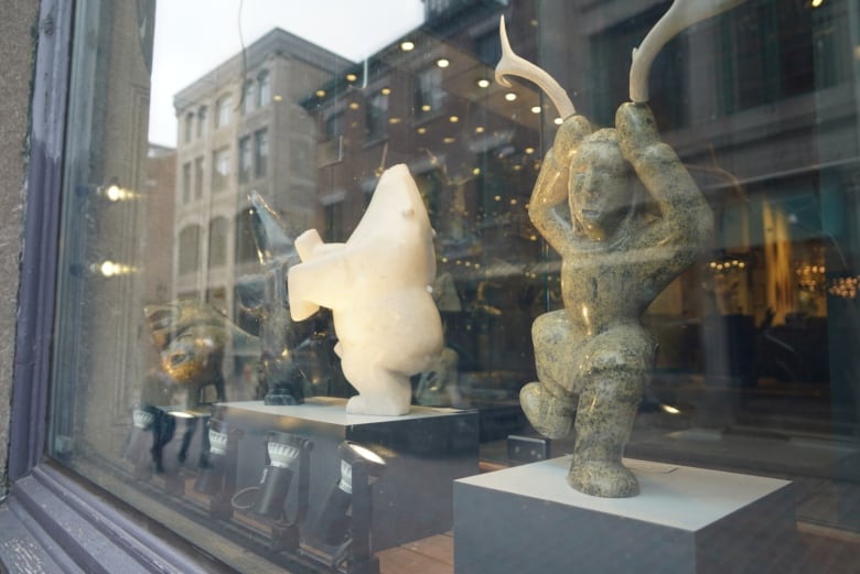 four stone statues