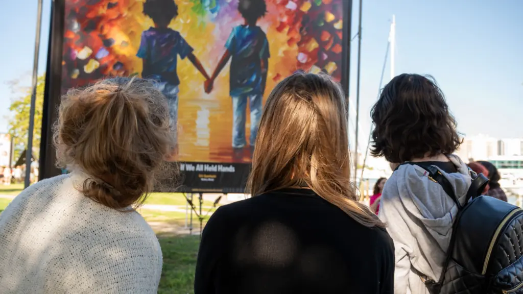 People at an outdoor art exhibit