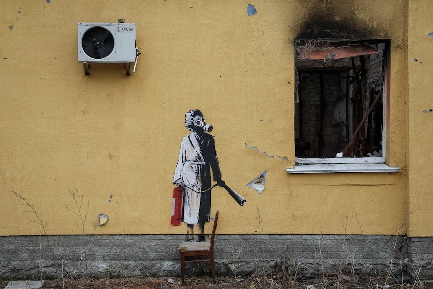 A graffiti image of a person in a gas mask