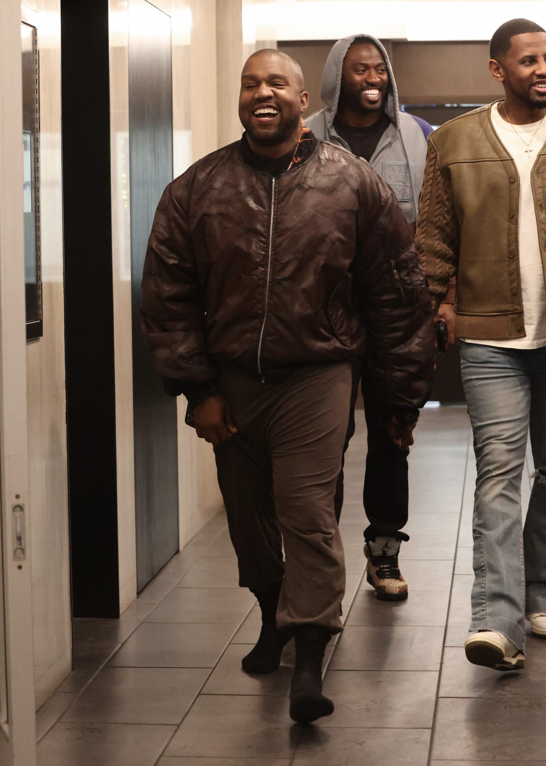 The controversial star has been traveling for months and appears to have ditched his fashion comeback for the time being