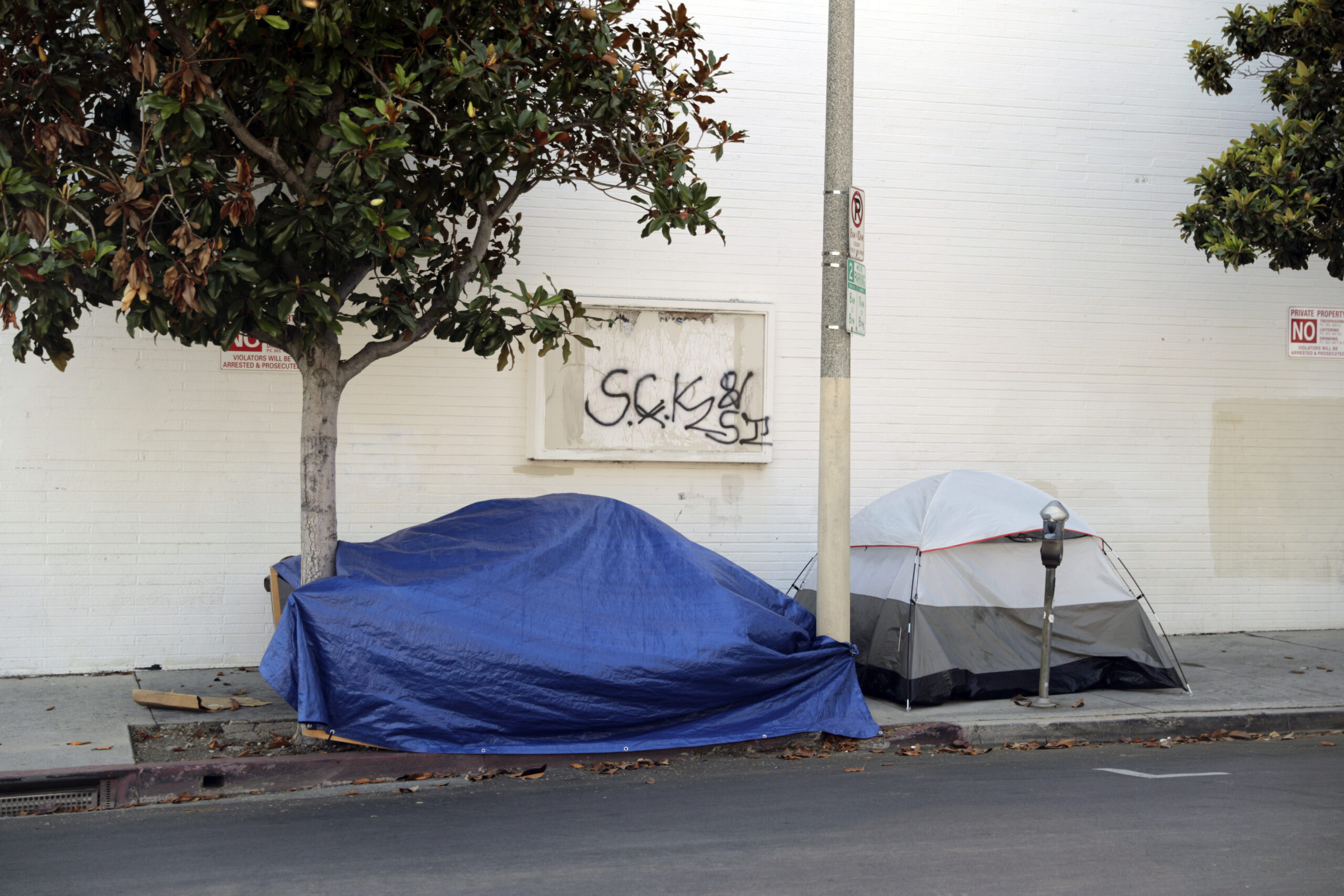 Tents are pictured where homeless people are camped opposite the offices on Melrose