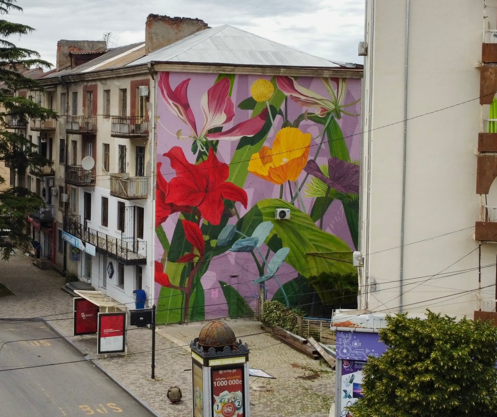 a bright floral mural in a city