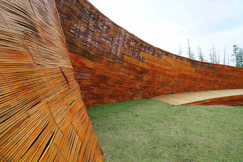 SODA architects plants bamboo stage installation amid mountains for qingshan art season