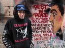 Downtown Eastside artist Smokey D. with some of his murals in Vancouver, B.C., December 28, 2016. Smokey lost his friend to a fentanyl overdose this year and starting painting murals depicting fentanyl overdose tragedies.