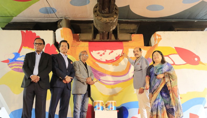 Dhaka North City Corporation mayor Md Atiqul Islam paints on a wall at an event, jointly organised by the DNCC and Berger Paints Bangladesh at Mohakhali Flyover in the capital on Monday. — New Age photo