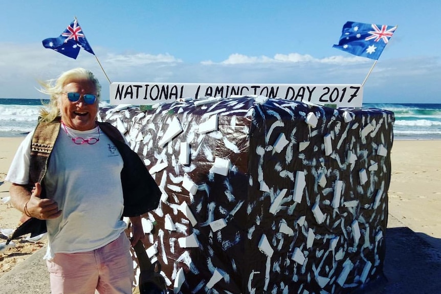 Maroubra's Rubiks Cube decorated as a lamington with man standing beside