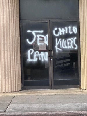 Liam Mackin is accused of spray-painting antisemitic graffiti on Flagler Beach buildings last month. Police say Mackin fled to Ireland.